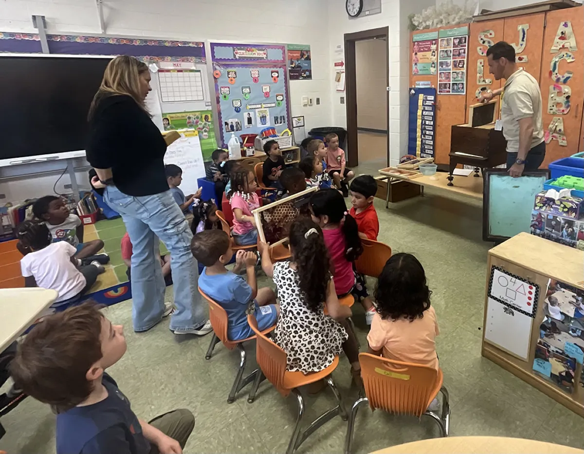 Students gathered for a classroom pollinator workshop