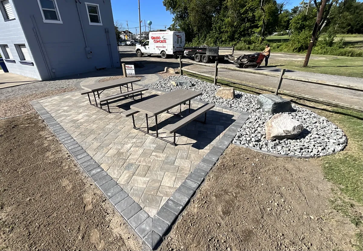 A new paver patio and rock garden gathering space at Elmer Little League